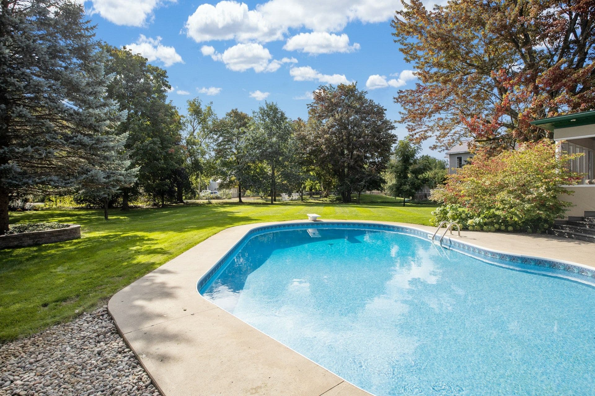 Clear blue swimming pool water in a North Texas backyard
